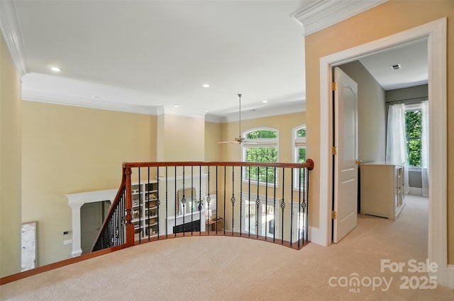hall with recessed lighting, ornamental molding, carpet flooring, and an upstairs landing