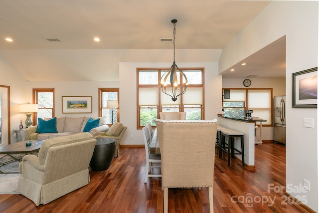 220 Stoney Falls Loop Unit C/2, Burnsville, NC 28714 - living room with a chandelier, a wealth of natural light, visible vents, and dark wood finished floors