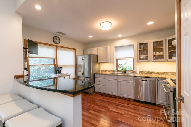 220 Stoney Falls Loop Unit C/2, Burnsville, NC 28714 - kitchen with visible vents, appliances with stainless steel finishes, a sink, dark wood-style floors, and glass insert cabinets