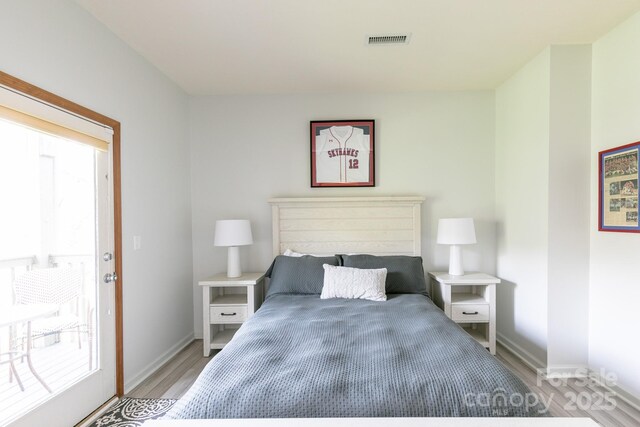 220 Stoney Falls Loop Unit C/2, Burnsville, NC 28714 - bedroom featuring baseboards, light wood-type flooring, and visible vents
