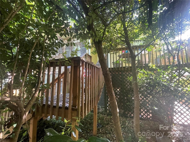 wooden deck featuring stairs