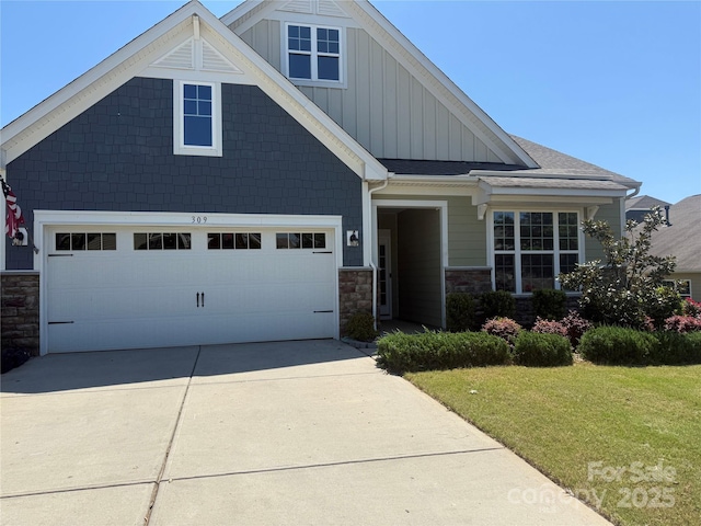 309 Kentmere Ln, Clover, SC 29710 - craftsman-style house featuring board and batten siding, concrete driveway, a front yard, and stone siding
