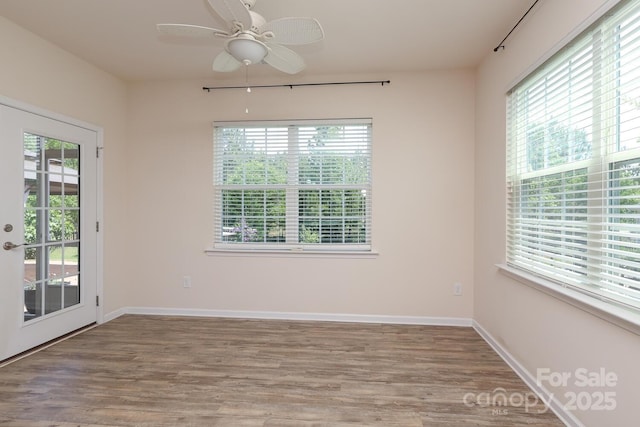 309 Kentmere Ln, Clover, SC 29710 - unfurnished room with a ceiling fan, wood finished floors, and a healthy amount of sunlight