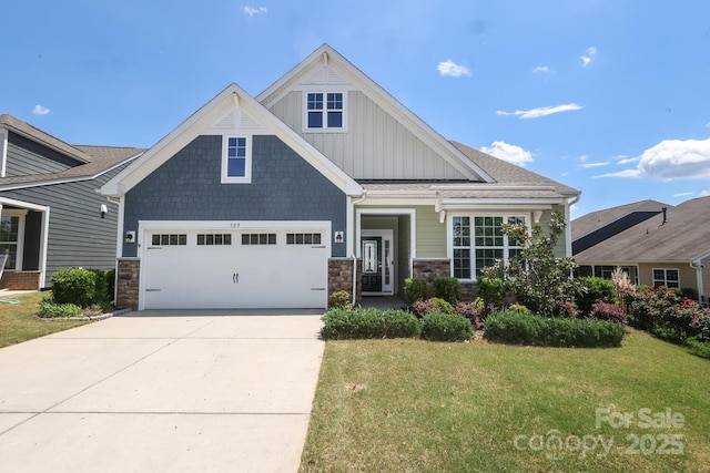 309 Kentmere Ln, Clover, SC 29710 - craftsman house featuring board and batten siding, driveway, a front lawn, an attached garage, and stone siding