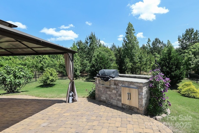 309 Kentmere Ln, Clover, SC 29710 - view of patio with an outdoor kitchen, fence, and grilling area