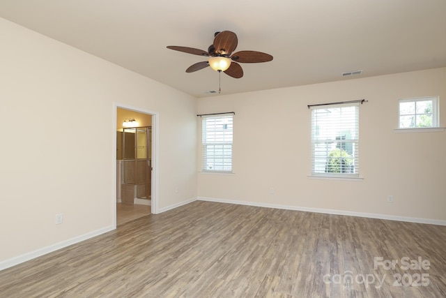 309 Kentmere Ln, Clover, SC 29710 - spare room featuring baseboards, ceiling fan, wood finished floors, and visible vents
