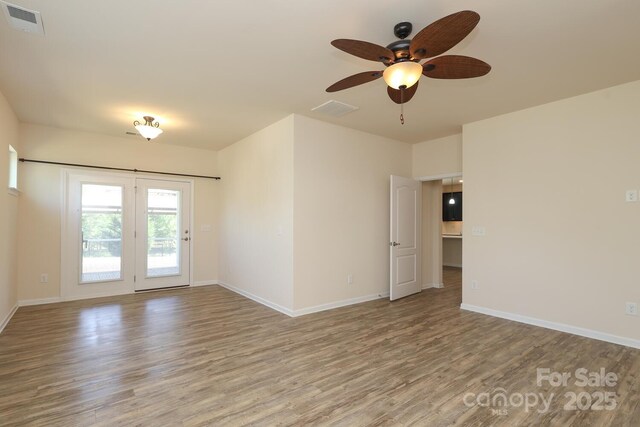 309 Kentmere Ln, Clover, SC 29710 - empty room featuring a ceiling fan, baseboards, visible vents, and wood finished floors