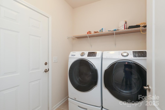 309 Kentmere Ln, Clover, SC 29710 - clothes washing area with baseboards, laundry area, light tile patterned flooring, and washing machine and clothes dryer