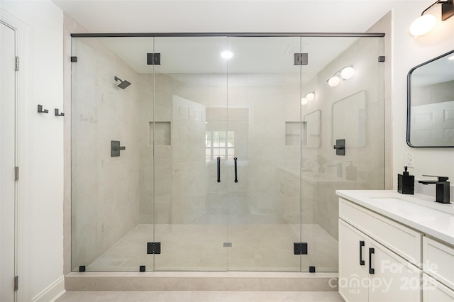 full bathroom featuring vanity and a stall shower
