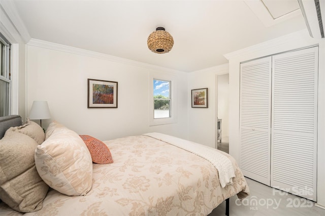 bedroom with ornamental molding and a closet