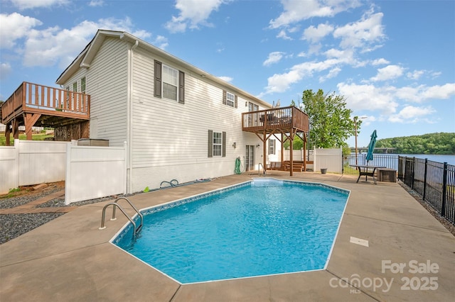 view of pool featuring a fenced in pool, fence, a deck, and a patio