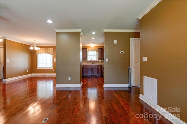 110 Carol Lyn Dr, Kings Mountain, NC 28086 - spare room with an inviting chandelier, plenty of natural light, dark wood-style flooring, and a sink