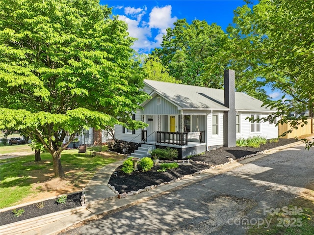 1104 Venus St, Kannapolis, NC 28083 - view of front of home with a chimney and a porch
