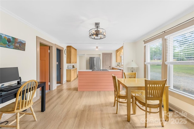 1104 Venus St, Kannapolis, NC 28083 - dining area with a chandelier, light wood-type flooring, a desk, baseboards, and crown molding