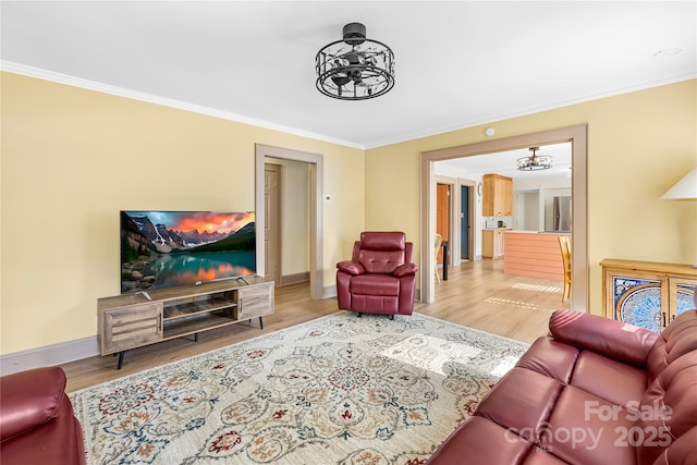 1104 Venus St, Kannapolis, NC 28083 - living area with a chandelier, crown molding, wood finished floors, and baseboards