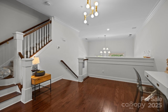 stairway featuring crown molding, a chandelier, wood finished floors, and baseboards
