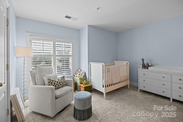 bedroom with visible vents and carpet floors