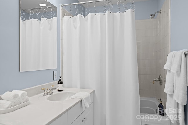 bathroom with shower / bath combination with curtain and vanity