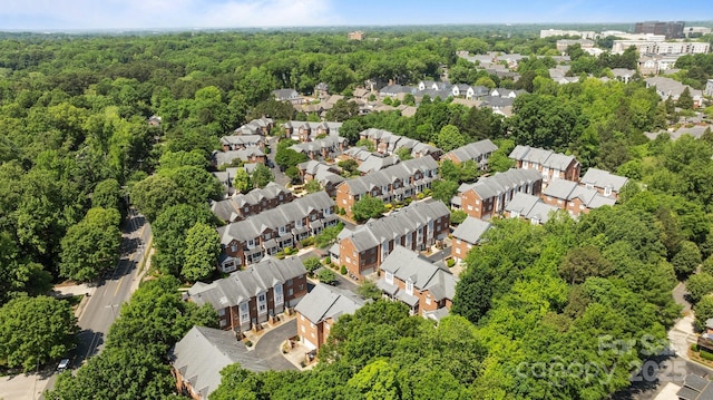 aerial view featuring a residential view and a view of trees