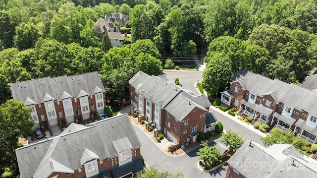 bird's eye view with a forest view and a residential view