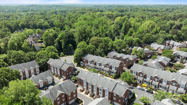 aerial view featuring a view of trees and a residential view