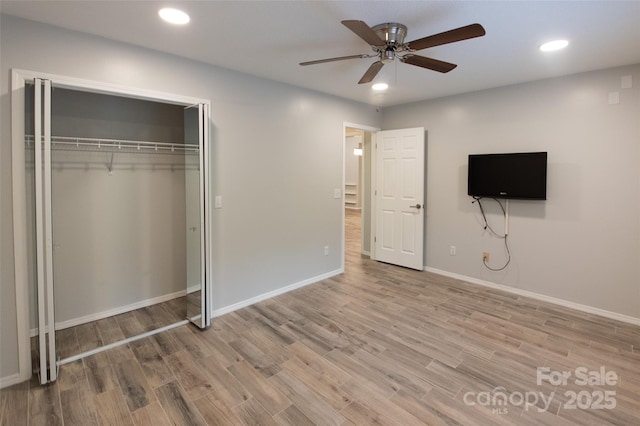 unfurnished bedroom with recessed lighting, baseboards, and wood finished floors