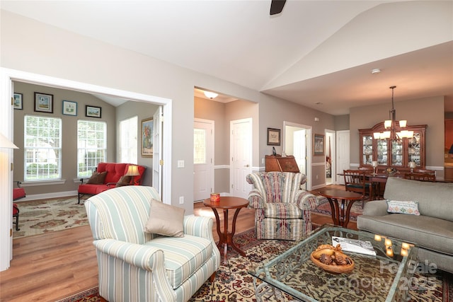 2114 N Castle Ct, Matthews, NC 28105 - living area featuring lofted ceiling, a wealth of natural light, and light wood-style floors