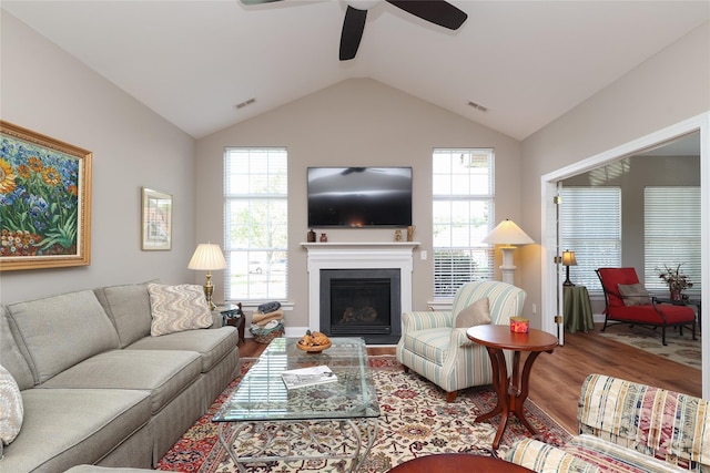 2114 N Castle Ct, Matthews, NC 28105 - living room with lofted ceiling, visible vents, a ceiling fan, and wood finished floors