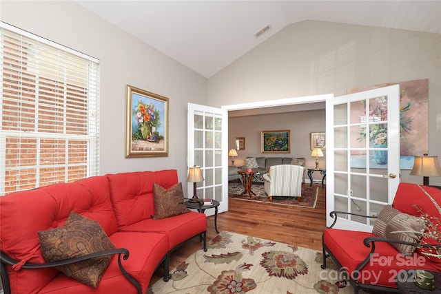 2114 N Castle Ct, Matthews, NC 28105 - living room with high vaulted ceiling, visible vents, and wood finished floors