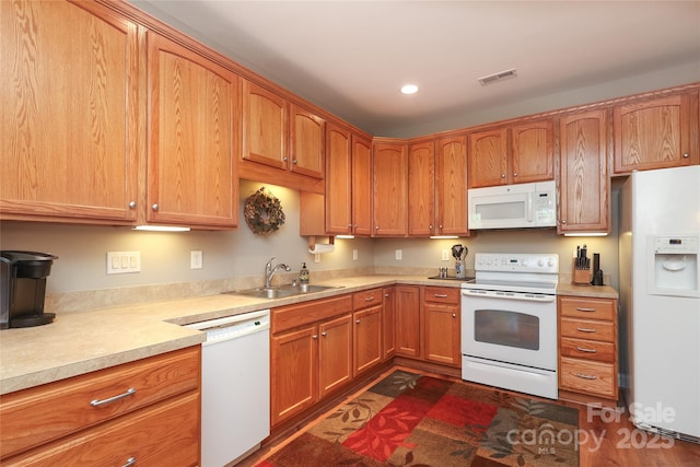 2114 N Castle Ct, Matthews, NC 28105 - kitchen featuring light countertops, visible vents, a sink, and white appliances