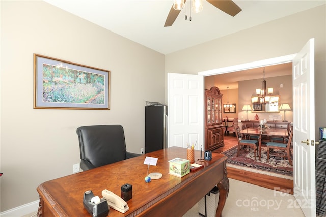 2114 N Castle Ct, Matthews, NC 28105 - office area with baseboards and ceiling fan with notable chandelier