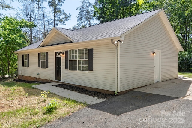 7525 Cedarbrook Dr, Charlotte, NC 28215 - view of front of property with a garage and a shingled roof