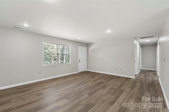 7525 Cedarbrook Dr, Charlotte, NC 28215 - empty room with attic access, visible vents, wood finished floors, baseboards, and recessed lighting