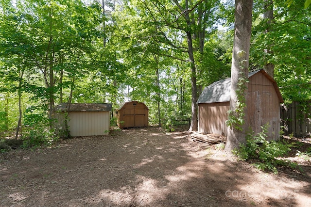 7525 Cedarbrook Dr, Charlotte, NC 28215 - view of yard featuring an outbuilding, fence, and a storage shed