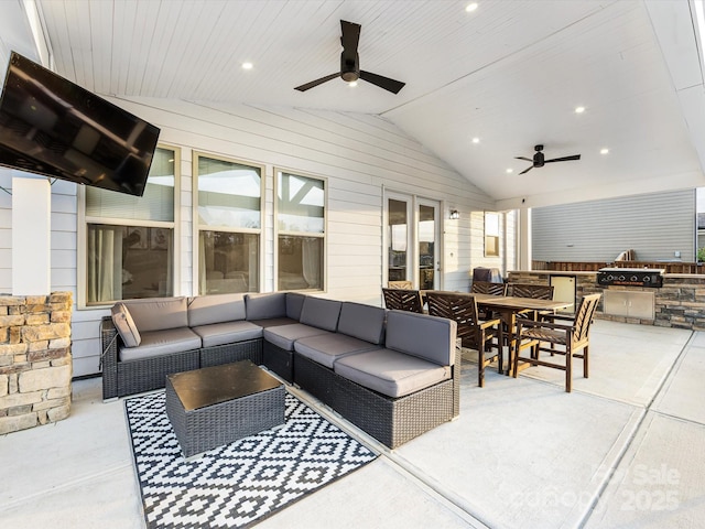 view of patio / terrace with an outdoor kitchen, outdoor lounge area, a ceiling fan, and outdoor dining space