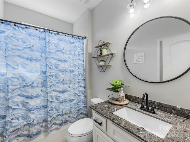 full bath featuring vanity, shower / bath combo, and toilet