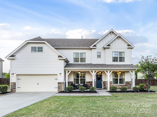 craftsman-style house featuring fence, an attached garage, a porch, a front yard, and concrete driveway