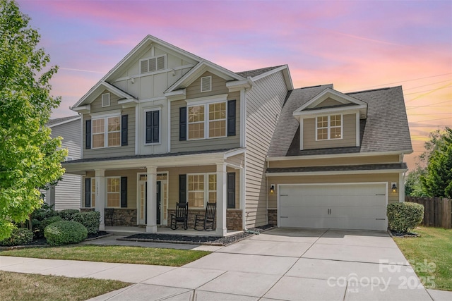 15807 Foreleigh Rd, Huntersville, NC 28078 - craftsman inspired home with covered porch, driveway, stone siding, a garage, and roof with shingles