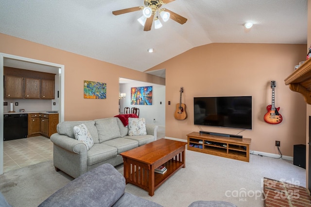 living room with baseboards, a ceiling fan, vaulted ceiling, and light carpet