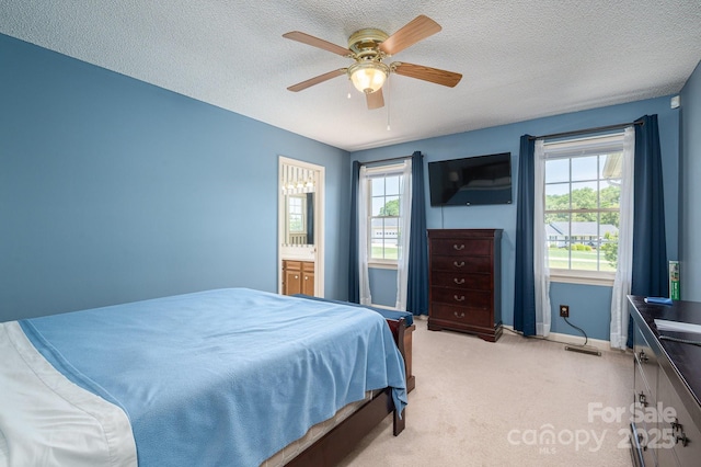 bedroom with light colored carpet, a textured ceiling, visible vents, and multiple windows