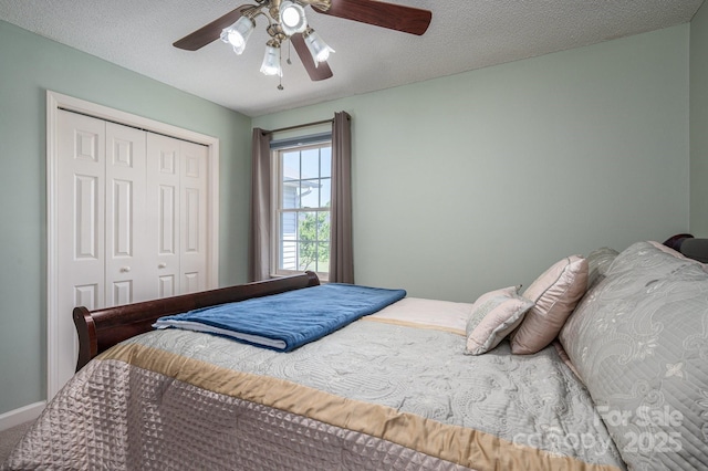 bedroom with ceiling fan and a closet