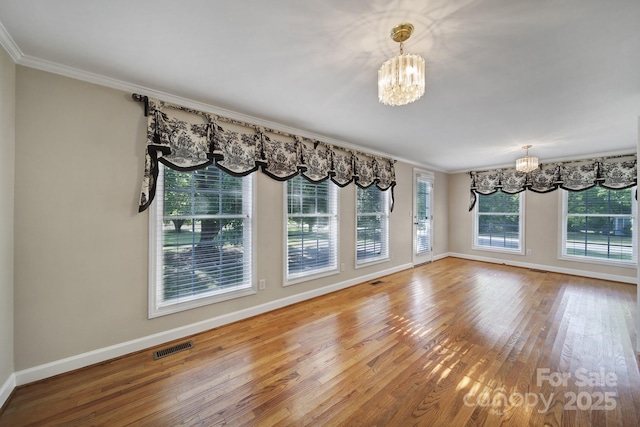 1723 Baskins Hill Rd, Heath Springs, SC 29058 - unfurnished dining area with baseboards, a notable chandelier, and wood finished floors