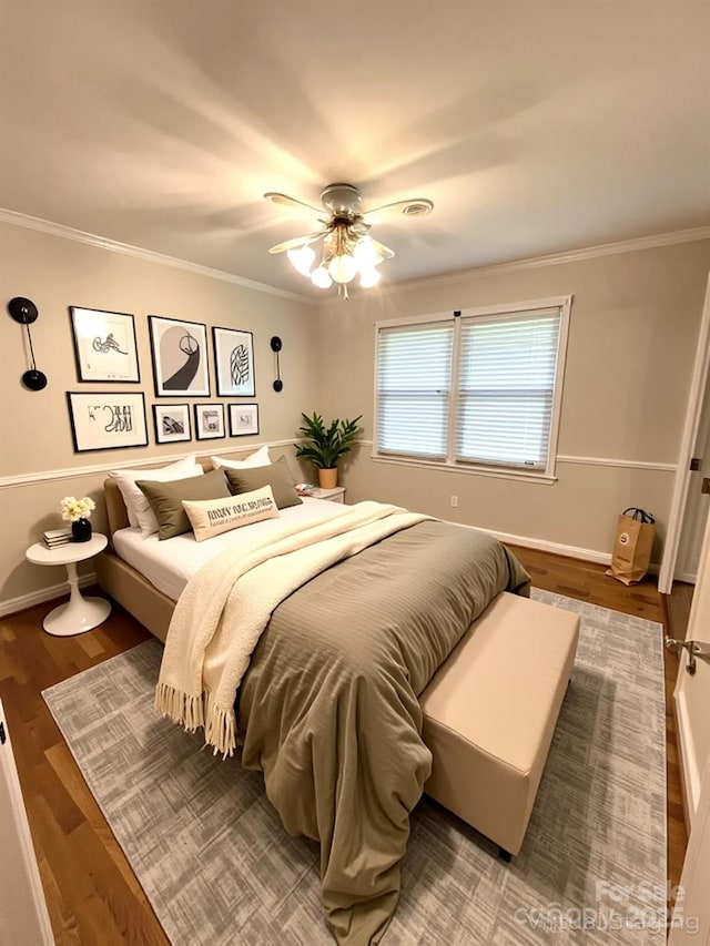 1723 Baskins Hill Rd, Heath Springs, SC 29058 - bedroom with ornamental molding, ceiling fan, and wood finished floors
