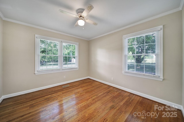 1723 Baskins Hill Rd, Heath Springs, SC 29058 - spare room with visible vents, crown molding, wood finished floors, baseboards, and ceiling fan