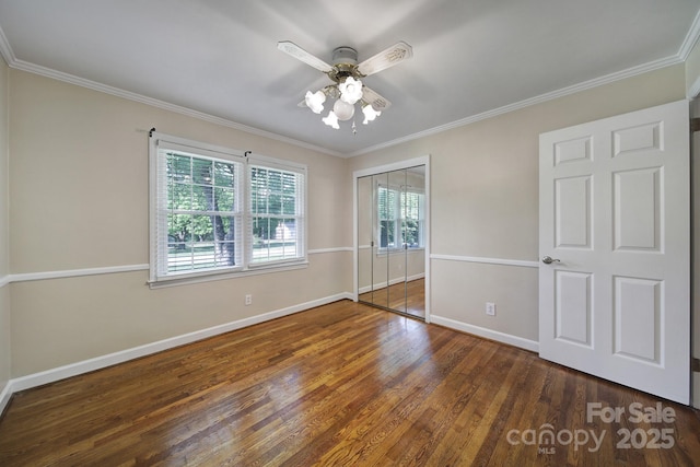 1723 Baskins Hill Rd, Heath Springs, SC 29058 - unfurnished bedroom featuring baseboards, ornamental molding, wood finished floors, and a closet