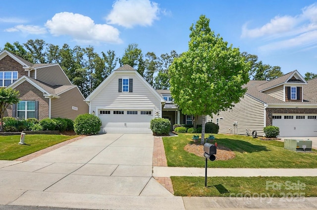 view of front of house with a garage, driveway, and a front lawn