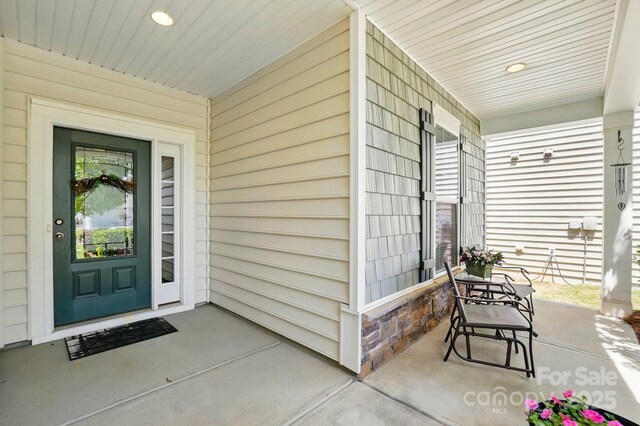doorway to property with a porch