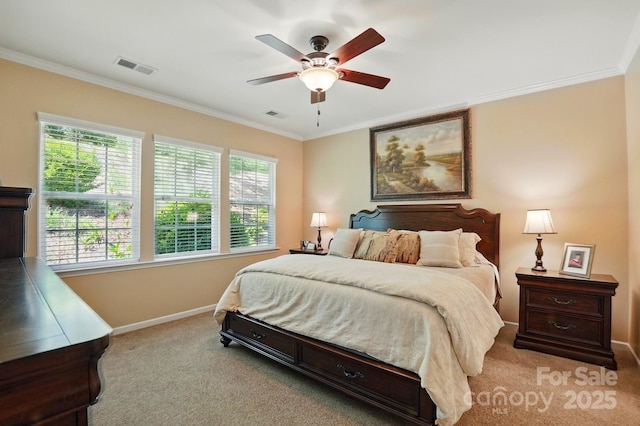bedroom with carpet flooring, baseboards, visible vents, and ornamental molding