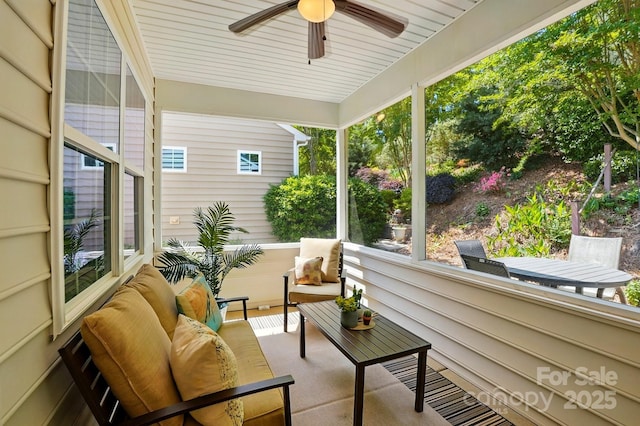 sunroom with ceiling fan and an outdoor hangout area