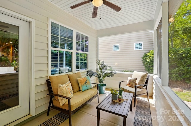 sunroom with a ceiling fan